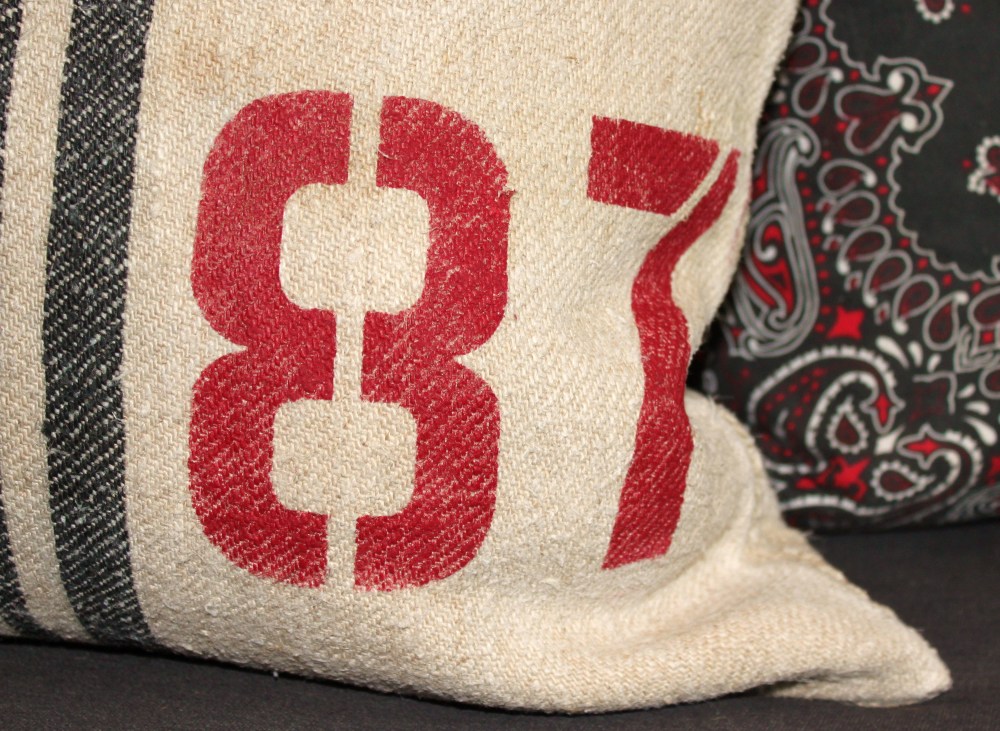 Close up Of 87 Painted on Grain Sack Pillow